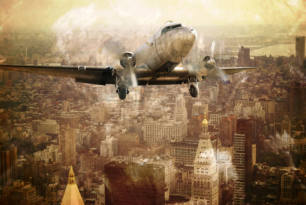 Bild von Papermoon Fototapete "Flugzeug über Stadt"