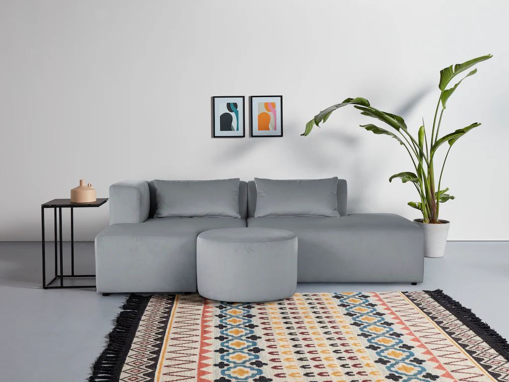 Bild von Leonique Ecksofa "Alexane L-Form", zusammengesetzt aus Modulen, in vielen Bezugsqualitäten und Farben.