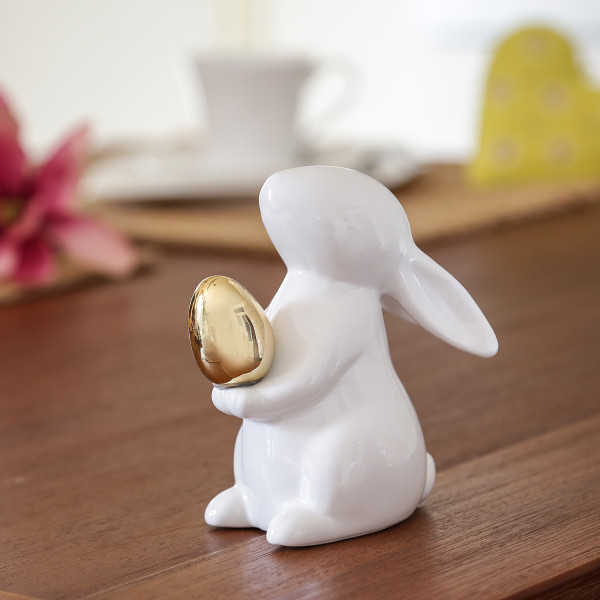 Bild von MARELIDA Osterhase Hase mit goldenem Ei Osterhase Frühling Osterdeko Dekofigur H: 13cm (1 St)
