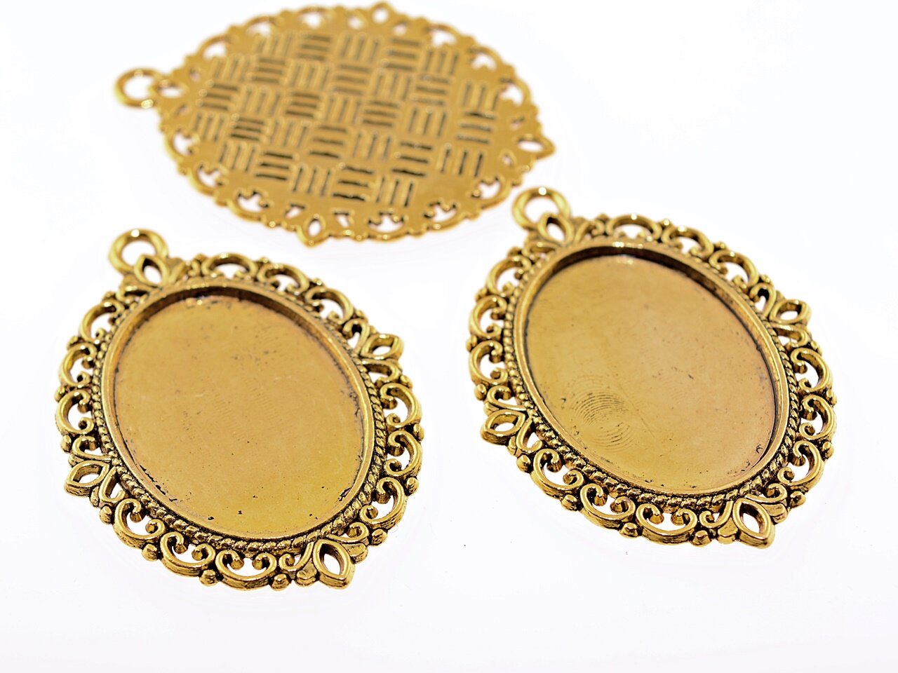Bild von 4 Medaillons in antik goldfarben für 25 x 18 mm Cabochons