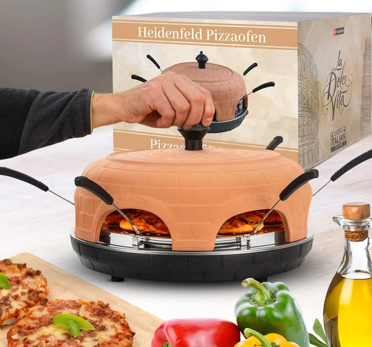 Bild von Heidenfeld Pizzaofen Pizzachef für 6 Personen mit 1100 Watt und Tonhaube, inklusive Pizzaschaufeln und Stahlplatte mit Haltegriff